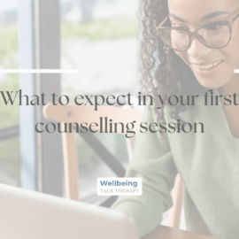 Woman sat looking at laptop smiling