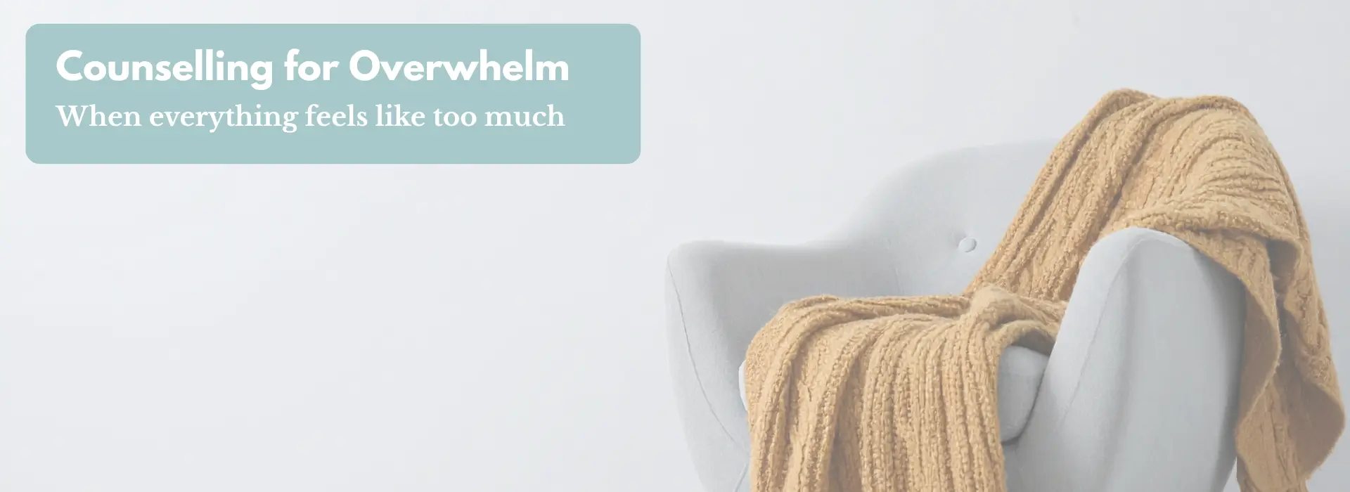Cosy armchair with a soft blanket in a warm, neutral room