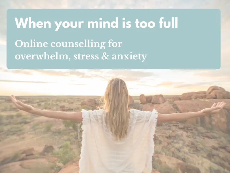 Woman standing peacefully outdoors with arms stretched wide, representing support for overwhelm, stress and anxiety