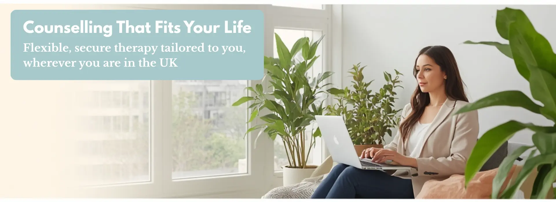 Professional woman using a laptop in a private space for online counselling