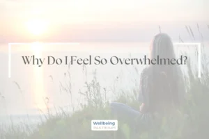 Woman sitting thoughtfully by a river, looking towards the sunset